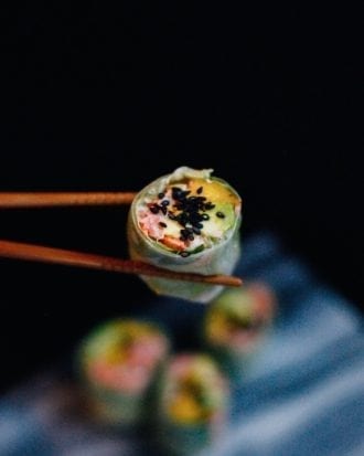 Sushi between chopsticks