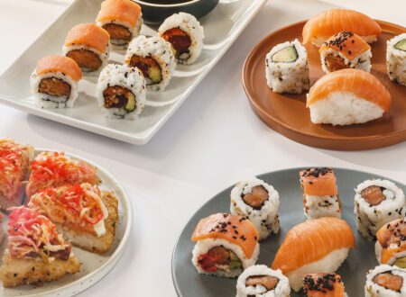 Three persons sharing plates of sushis