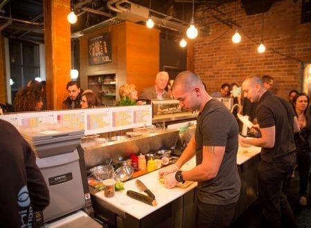 Team making sushis in a Sushi Shop restaurant