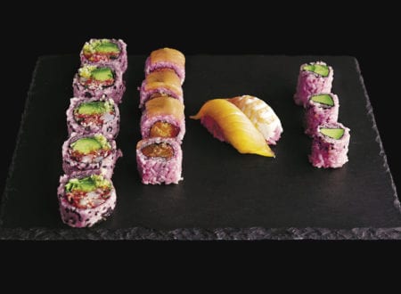 Variety of sushi with pink rice